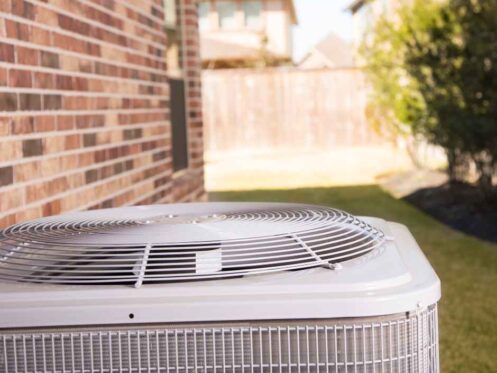 An air conditioning unit on the outside of a home